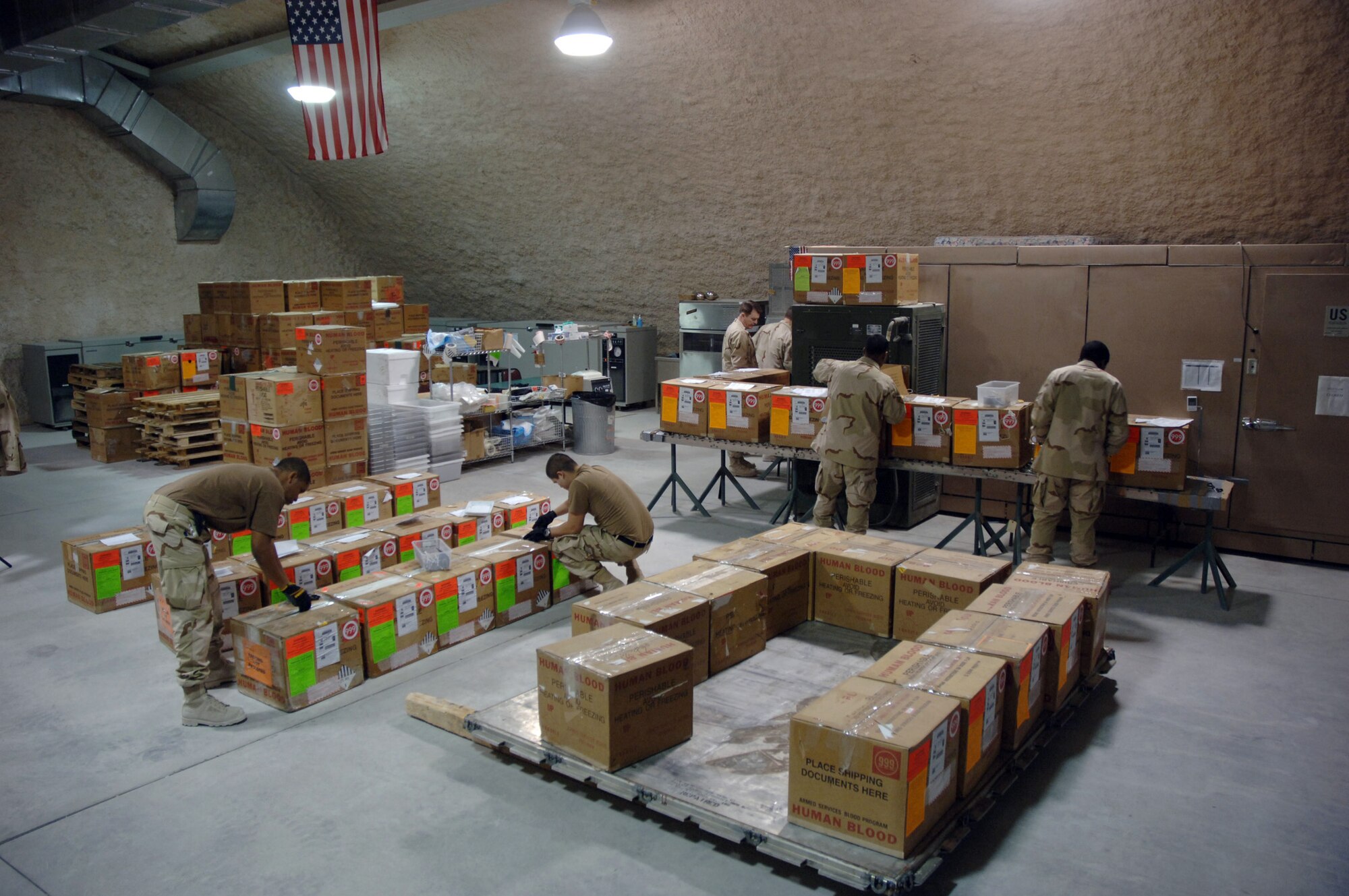 SOUTHWEST ASIA (AFPN) -- Members of the 379th Expeditionary Medical Support Flight blood transshipment center receive, log and prepare blood for shipment here Jan. 28. The center gets blood from the United States and sends it throughout the region. (U.S. Air Force photo by Staff Sgt. Joshua Strang)