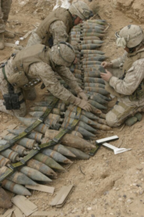 U.S. Marine engineers prepare to destroy artillery shells found in an old ammunition supply point near Hit, Iraq, on Jan. 23, 2006. Destroying the ordnance will deny their use in improvised explosive devices by insurgents. The Marines are assigned to Golf Battery, Battalion Landing Team 1st Battalion, 2nd Marine Regiment. 