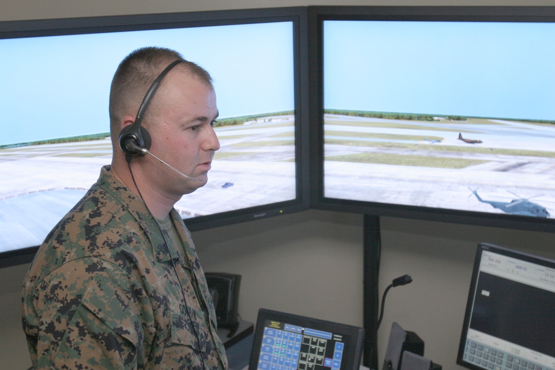 Cpl. Jon P. Corbin trains on the Air Traffic Control?s new MaxSim ATC simulation system here Oct. 31. Corbin, an ATC tower watch supervisor, developed a specialized graphic scheme mimicking the landscape and characteristics of Cherry Point?s airfield.