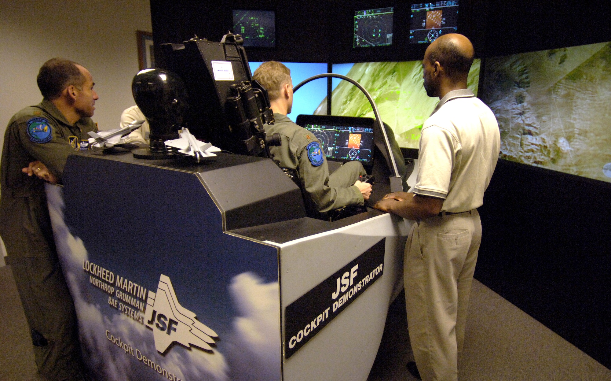 HICKAM AIR FORCE BASE, Hawaii (AFPN) -- Maj. Don Borchelt flies the F-35 Joint Strike Fighter aircraft simulator here. The simulator demonstrates the advanced capabilities of the F-35 -- the joint fighter of the 21st century. Major Borchelt is from the Headquarters Pacific Air Force advanced programs office. (U.S. Air Force photo by Tech. Sgt. Shane A. Cuomo) 