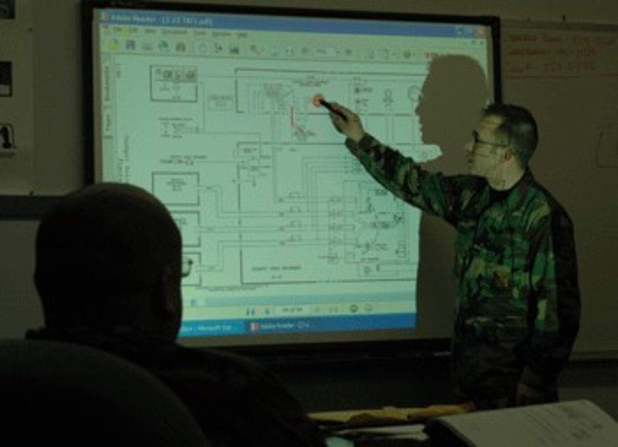 Staff Sgt. Jason Bronaugh, KC-10 Communication Navigation instructor, explains how the cockpit voice recorder works.