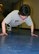 TINKER AIR FORCE BASE, Okla. (AFMCNS) - Bunny Greenroyd, 552nd Communications Group commander's secretary, performs an Air Force push-up.  A little less than a year ago the 58-year-old Greenroyd could only do one or two.  Now she can do 100. (Air Force photo by Staff Sgt. Stacy Fowler)
