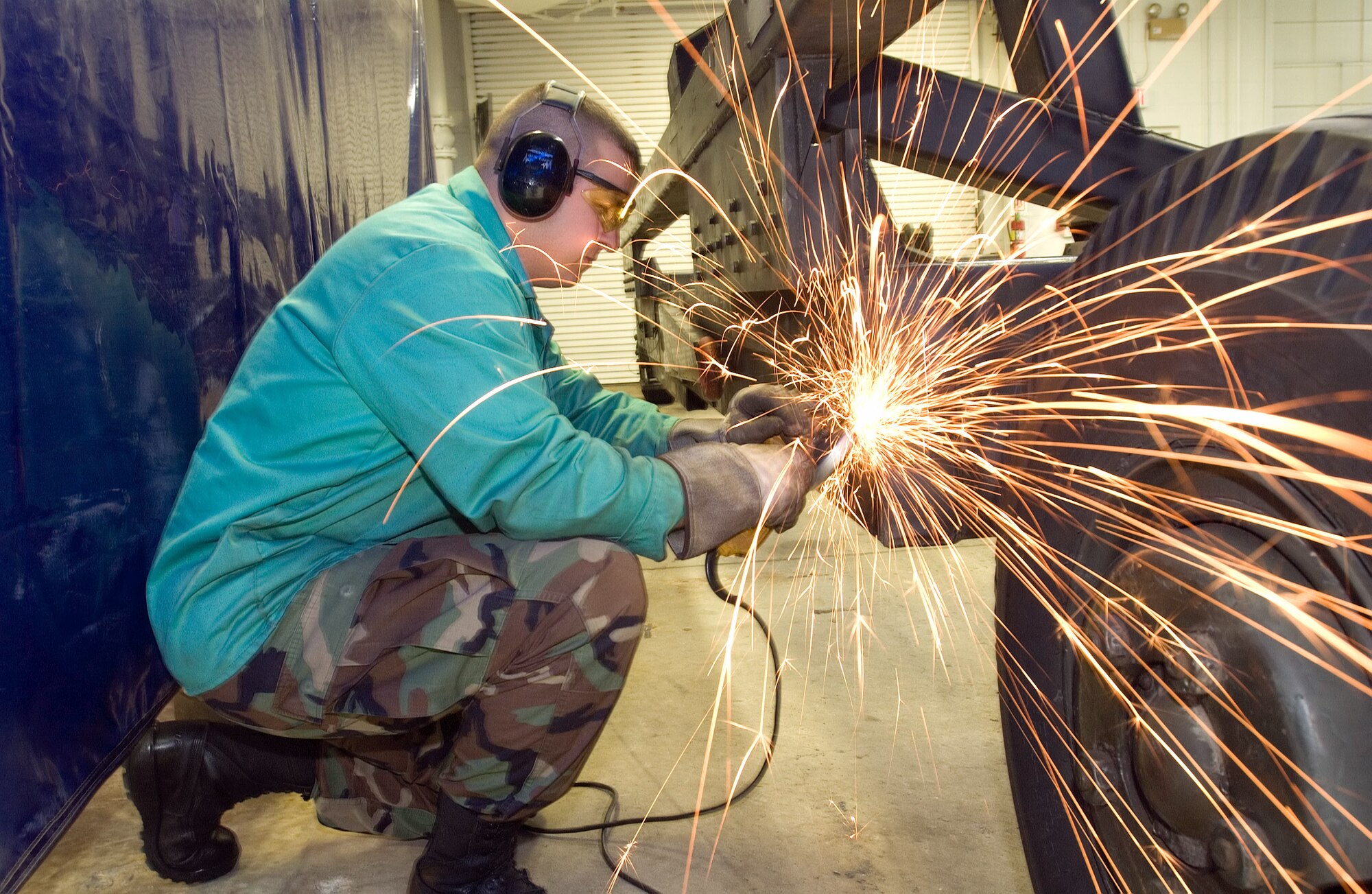 DOVER AIR FORCE BASE, Del. (AFPN) -- Senior Airman Duane Miles prepares metal for C-5 Galaxy engine maintenance. Airman Miles is assigned to the 512th Equipment Maintenance Squadron.  The squadron is a unit of the 512th Airlift Wing, which is the only Air Force Reserve Command unit in Delaware and has 1,870 Reservists. Airmen of the 512th AW work side-by-side with the 436th Airlift Wing to maintain and fly the C-5 Galaxy. (U.S. Air Force photo by Jason Minto)