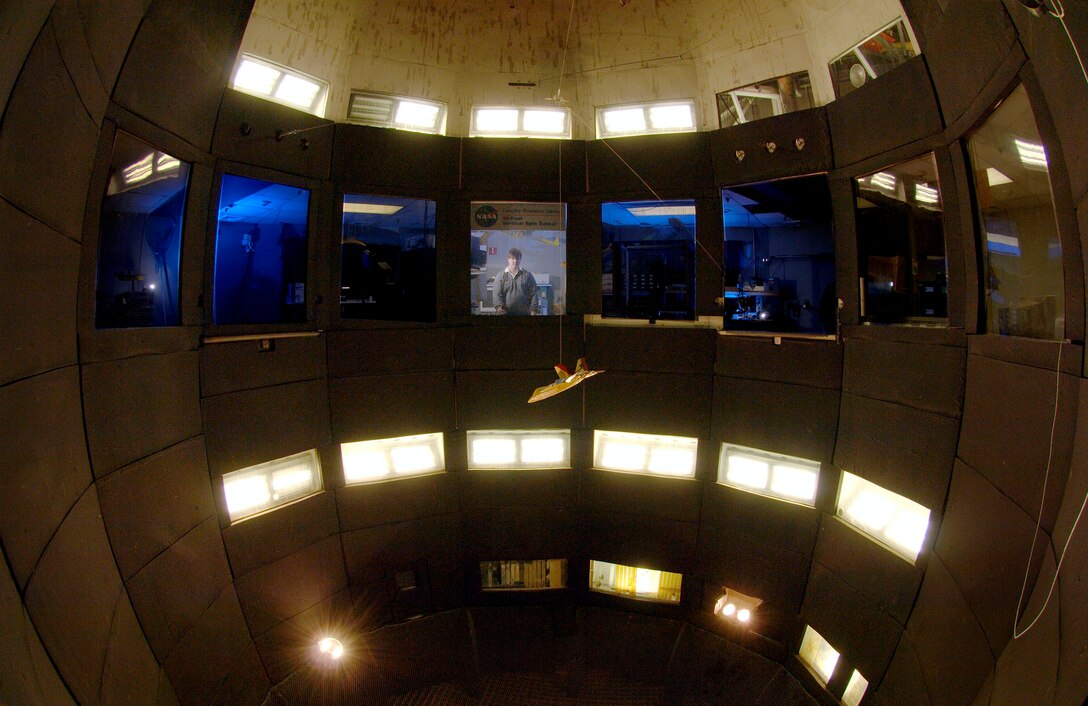 LANGLEY AIR FORCE BASE, Va. (AFPN) -- Steven Riddick tests an F-22A Raptor model in NASA's 20-foot vertical spin tunnel here. Data gathered from these tests can determine how an aircraft or spacecraft would react to various atmospheric conditions. Mr. Riddick is an aerospace technology engineer for the National Aeronautics and Space Administration. (U.S Air Force photo by Staff Sgt. Eric T. Sheler)