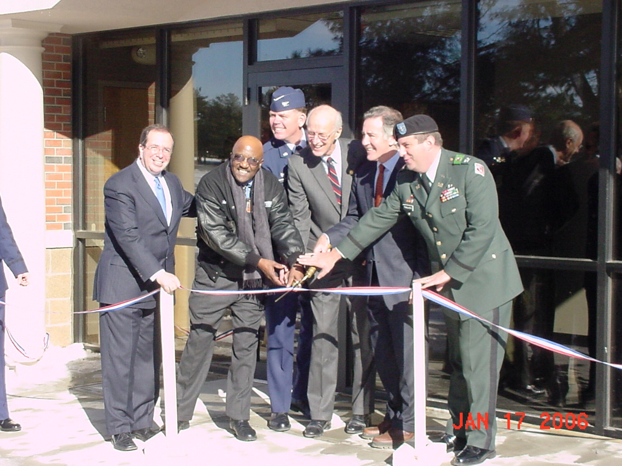 Col. Wade Farris, 439th Airlift Wing commander, cuts the ribbon with local congressmen and Army Corps of Engineers officials Jan. 17 for the new security forces building at Westover. The new building will house the 140-member 439th Security Forces Squadron under one roof. It is scheduled to open in mid-February. (U.S. Air Force photo/Tech Sgt. Andrew Biscoe)
