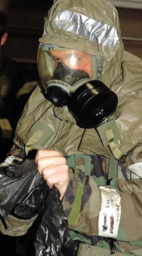 Senior Airman Keith Stetser, 28th Communications Squadron, 28th Bomb Wing, Ellsworth Air Force Base, S.D., processes through the Contamination Control Area 6 Nov 05. SrA Stetser is participating in Ellsworth's Badlands Express 06-01 Operational Readiness Exercise. (US Air Force Photo By: AirmanErica M. Stratton)(RELEASED)