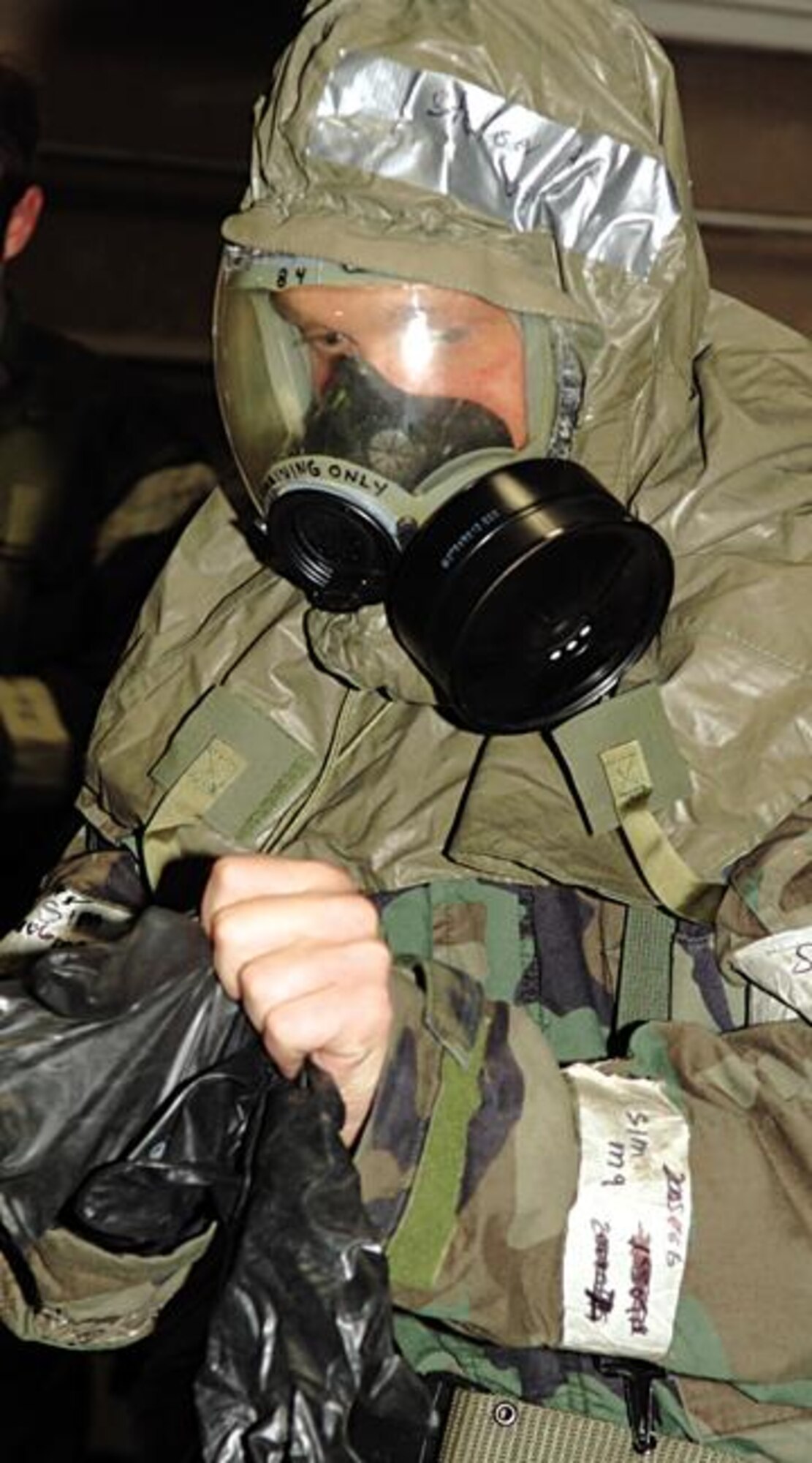 Senior Airman Keith Stetser, 28th Communications Squadron, 28th Bomb Wing, Ellsworth Air Force Base, S.D., processes through the Contamination Control Area 6 Nov 05. SrA Stetser is participating in Ellsworth's Badlands Express 06-01 Operational Readiness Exercise. (US Air Force Photo By: AirmanErica M. Stratton)(RELEASED)
