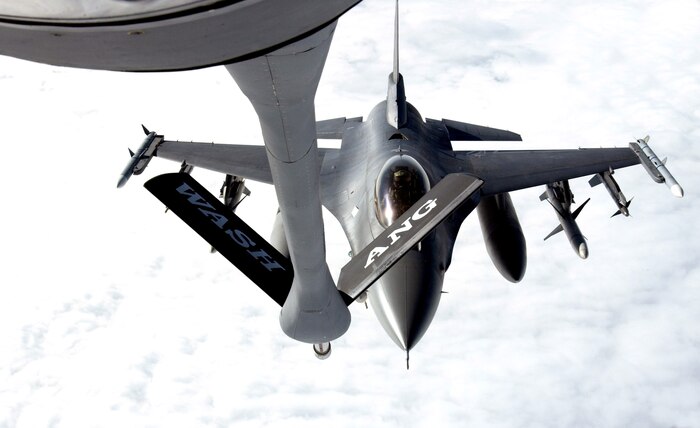 NELLIS AIR FORCE BASE, Nev. (AFPN) -- An F-16 Fighting Falcon moves in to receive fuel from a KC-135 Stratotanker Jan. 30, during Red Flag 06-1 being held here Jan. 21 through Feb. 18.  Red Flag tests aircrews' war-fighting skills in realistic combat situations. More than 85 aircraft, including B-2 Spirit bombers are involved. The aircraft are flying missions day and night to the nearby Nevada Test and Training Range where they simulate air war.  Along with the Air Force, units from the Army, Navy, Marine Corps, United Kingdom and Australia are participating. (U.S. Air Force photo by Master Sgt. Kevin J. Gruenwald)
