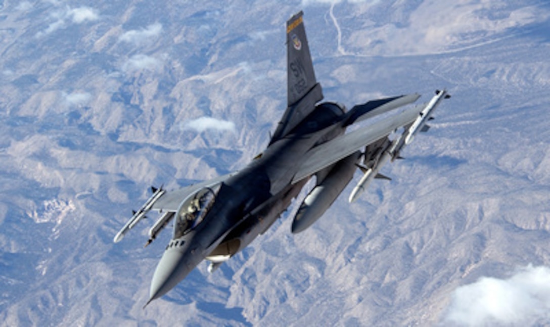 A U.S. Air Force F-16 Fighting Falcon heads out to the combat ranges of Nellis Air Force Base, Nev., for airpower training exercise Red Flag 06-1, on Jan. 30, 2006. Conducted by the 414th Combat Training Squadron, Red Flag exercises test aircrews' war-fighting skills in realistic combat situations and involve units of the U.S. Air Force, Army, Navy, Marine Corps, as well as units of the United Kingdom and Australia. This Fighting Falcon is attached to the 20th Fighter Wing, Shaw Air Force Base, S.C. 
