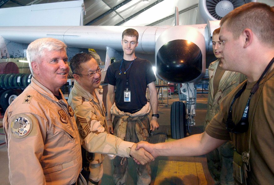 Maj. Gen. Allan Poulin, left, vice commander of Air Force Reserve Command, and Chief Master Sgt. Lawrence Chang, 10th Air Force command chief master sergeant, meet with Airmen deployed from Spangdahlem Air Base, Germany, and Air Force Reservists deployed from Whiteman Air Force Base, Mo., June 28 at Bagram Airfield, Afghanistan. (US Air Force photo/Maj. David Kurle)