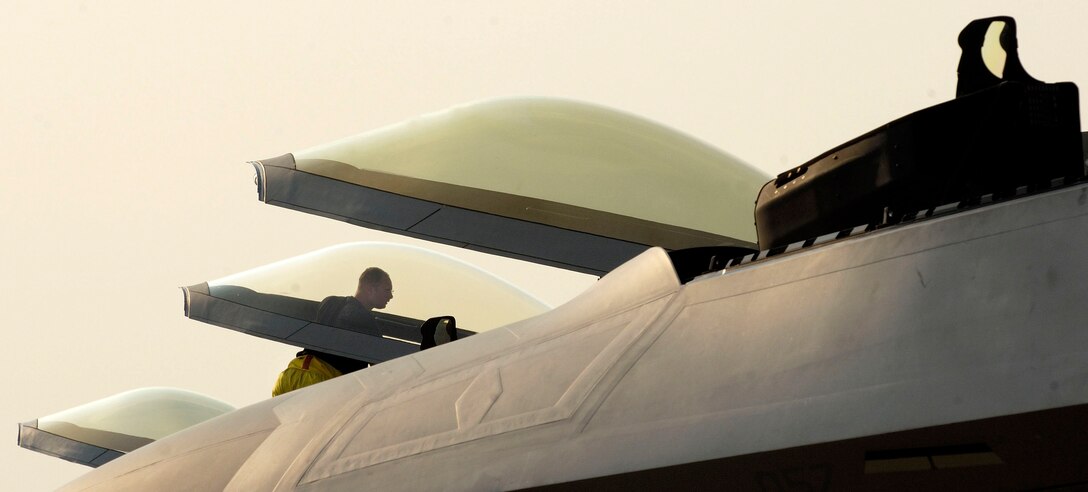 Staff Sgt. Jeff Zadorwitz performs a post-flight inspection on an F-22 Raptor at Naval Air Station Oceana, Va., on Friday, June 30. The Raptors are assigned to the 27th Fighter Squadron at Langley Air Force Base, Va. The 27th, 71st and 94th FS from Langley are flying sorties from other installations because of runway repairs at their home station. Sergeant Zadorwitz is a crew chief with the 27th Fighter Squadron from Langley Air Force Base, Va. (U.S. Air Force photo/Staff Sgt. Samuel Rogers)