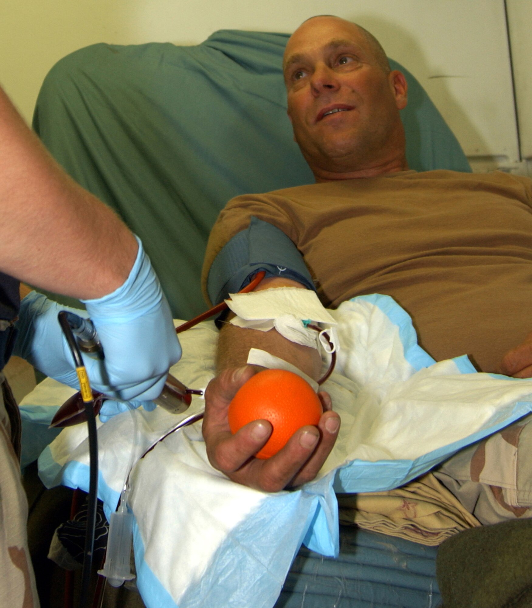 Staff Sgt. Bret Departu donates his eighth unit of platelets at Balad Air Base, Iraq. He is an Air National Guardsman with the 332nd Expeditionary Security Forces Squadron. (U.S. Air Force photo/Senior Airman James Croxon) 
