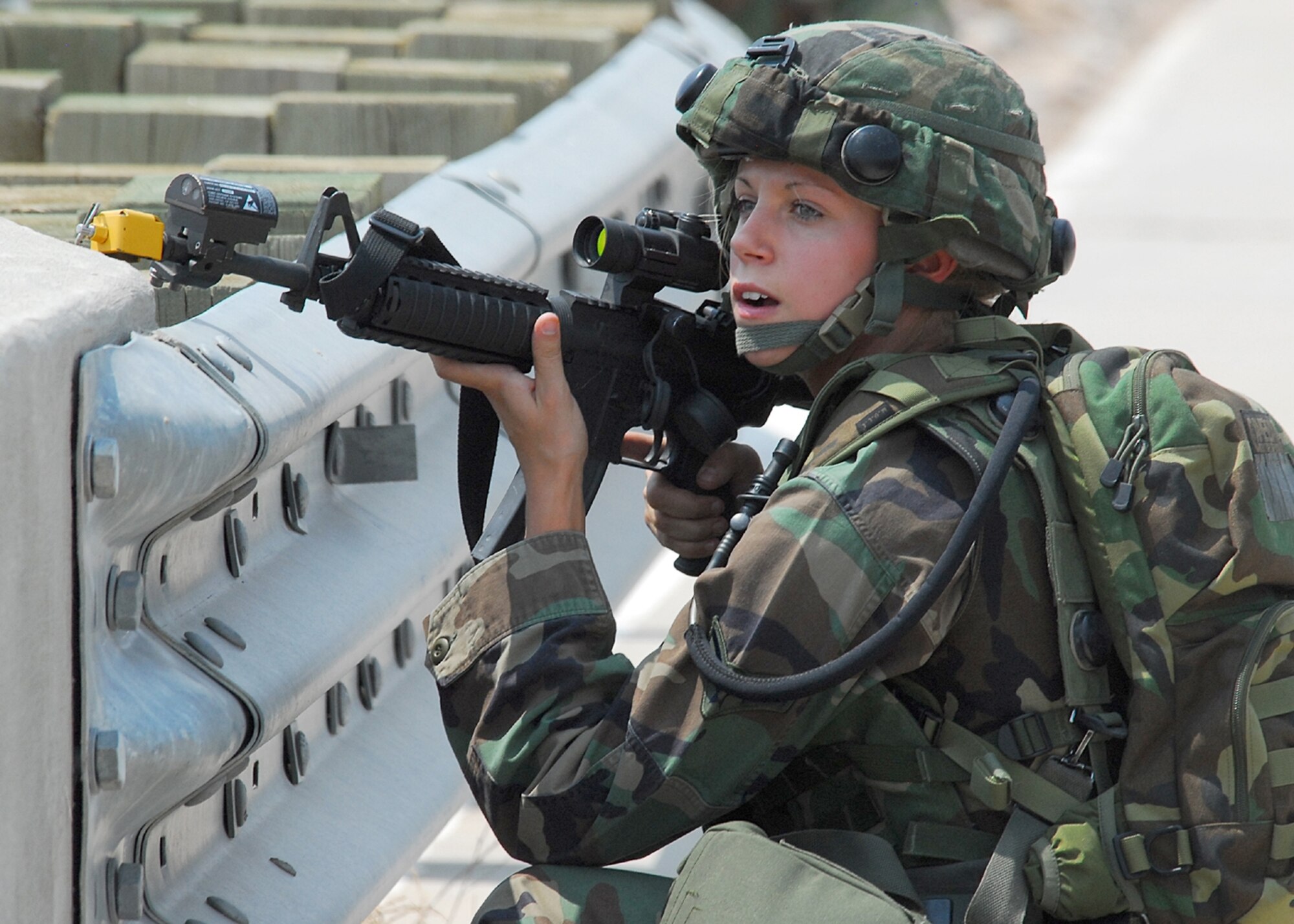 KIRTLAND AIR FORCE BASE, N.M. — Airman 1st Class Ashley Gonzalez, 377th Security Forces Squadron, scans the area for the enemy during the exercise.  (Air Force photos by Todd Berenger)
