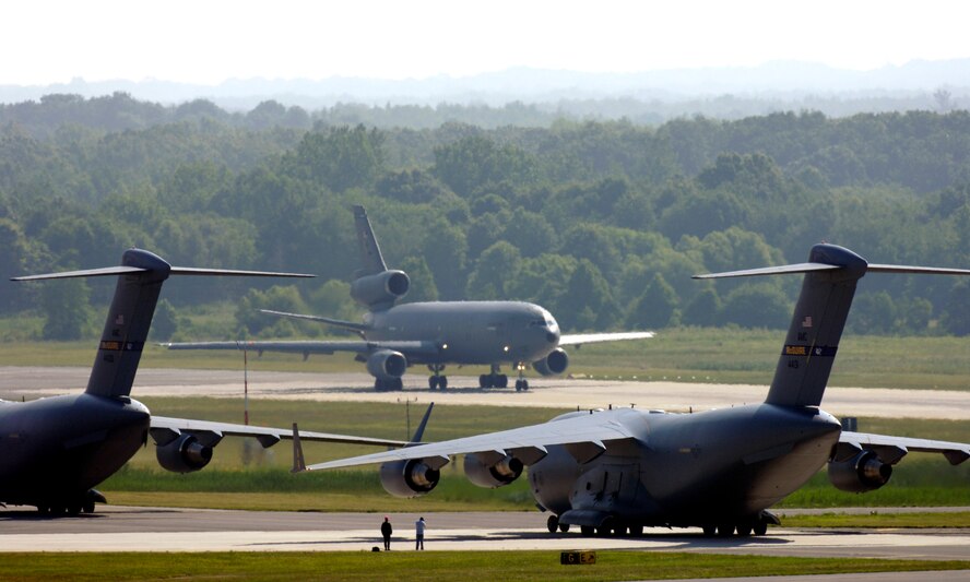 KC-10 Extenders and C-17 Globemaster IIIs from McGuire Air Force Base, N.J., taxi down the flightline during the emergency response exercise Elephant Walk. This is the first time C-17s and KC-10s have been paired in an exercise. Sixteen aircraft launched from McGuire on Friday, June 30, as part of the exercise. (U.S. Air Force photo/Carlos Cintron)