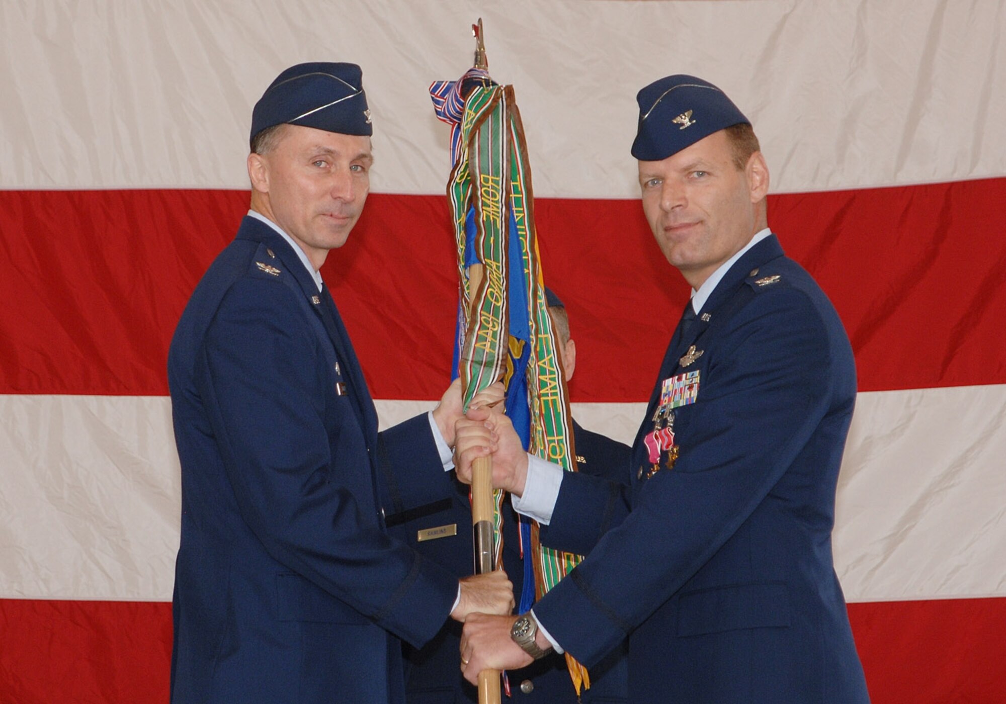 Col. Lee DeRemer (right) relinquished command of the 319th Operations Group June 29 in an ceremony presided over by Col. Bill Bender, 319th Air Refueling Wing commander.  Col. DeRemer thanked the group for their hard work and sacrifice. (Photo by Airman First Class Chad Kellum)