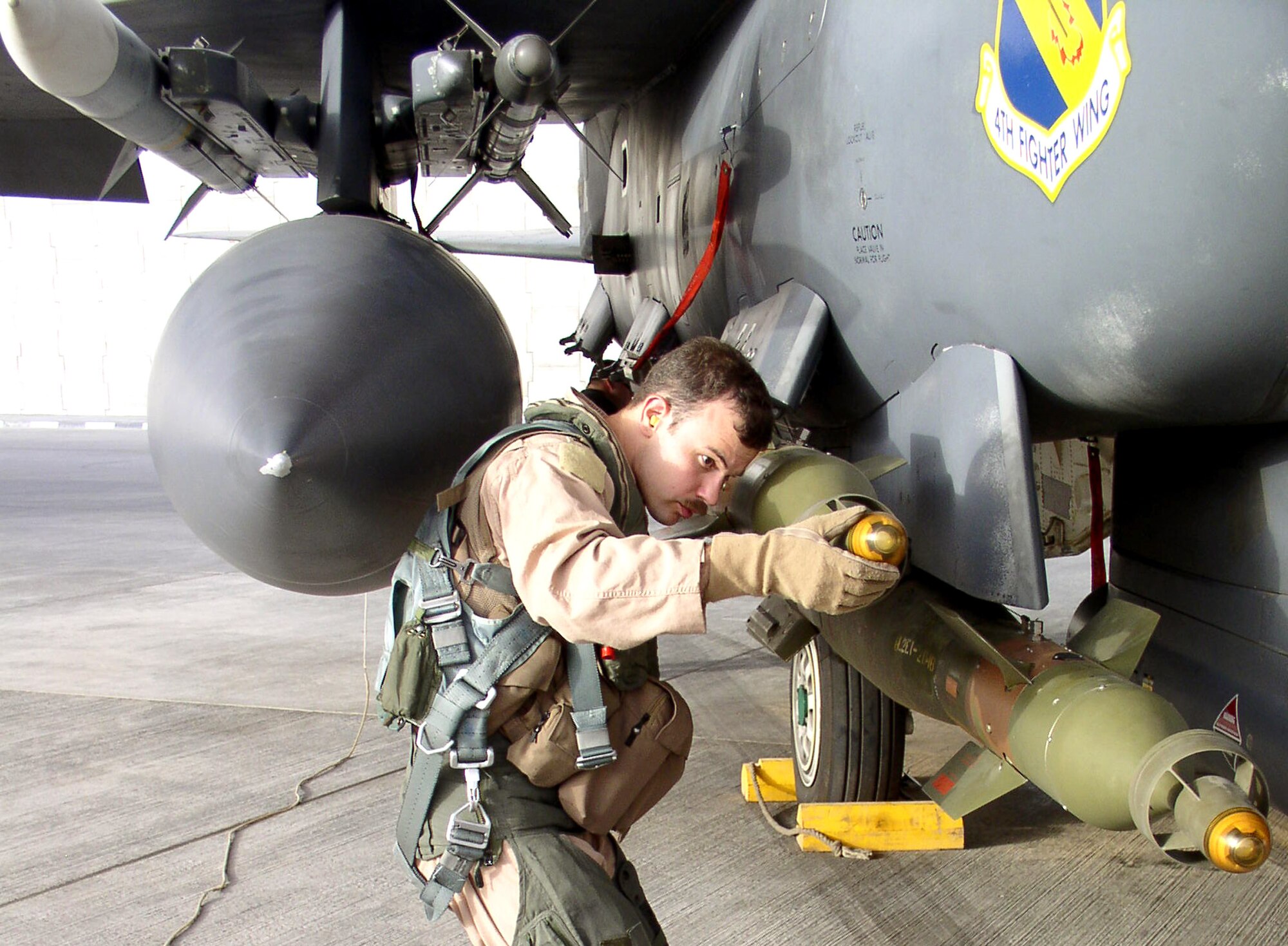 First Lt. Benjamin Aldus inspects a guided bomb unit-12 bomb during a preflight inspection at a forward operating location in Southwest Asia on Sunday, July 2. Lieutenant Aldus is an F-15 Eagle weapons system officer with the 335th Expeditionary Fighter Squadron and is deployed from the 335th Fighter Squadron at Seymour Johnson Air Force Base, N.C. (U.S. Air Force photo/Master Sgt. Dutch DeGroot)