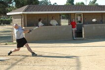 Michael Shirley, 60th Security Forces Squadron, gets a base hit for 60th Mission Support Squadron during intramural softball game at Travis Air Force Base, Calif. June 29.   MSS defended their undefeated record against the 60th Dental Squadron by a score of 35-2. (Photo by Tech. Sgt. Donald Osborn)