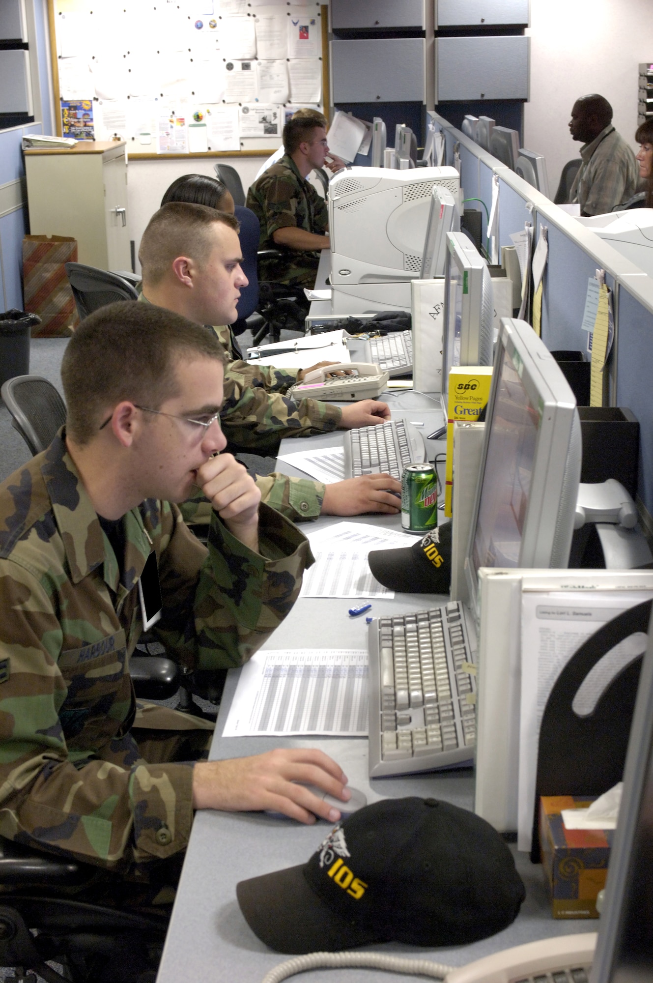 Airmen with the 67th Network Warfare Wing monitor internet activity to maintain security of Air Force computer networks at Lackland Air Force Base, Texas, on Friday, July 7. (U.S. Air Force photo/Master Sgt. Jack Braden) 
