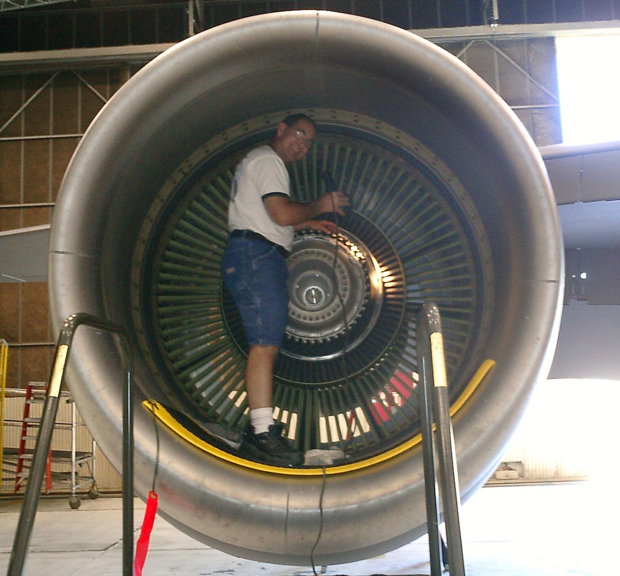 BEALE AIR FORCE BASE, Calif. -- Master Sgt. Michael Harriman, a propulsion inspector with the 940th Maintenance Squadron, checks engine fan blades of an Air Force Reserve Command KC-135T for imperfections and wear July 6, 2006 during periodic maintenance.  Due to a series of modernizations and careful maintenance through the years, the KC-135 is now one of the oldest, yet most reliable, aircraft defending America.  Sergeant Harriman was inspecting Tail Number 60-0345, one of the youngest aircraft in the fleet.  It was first delivered to the Air Force by Boeing on May 12, 1961. The KC-135 fleet will celebrate its 50th birthday in September. For more information on the KC-135 50th anniversary celebration, go to http://www.kc135.org/ . (U.S. Air Force photo/Tech. Sgt. Bryan Smith)