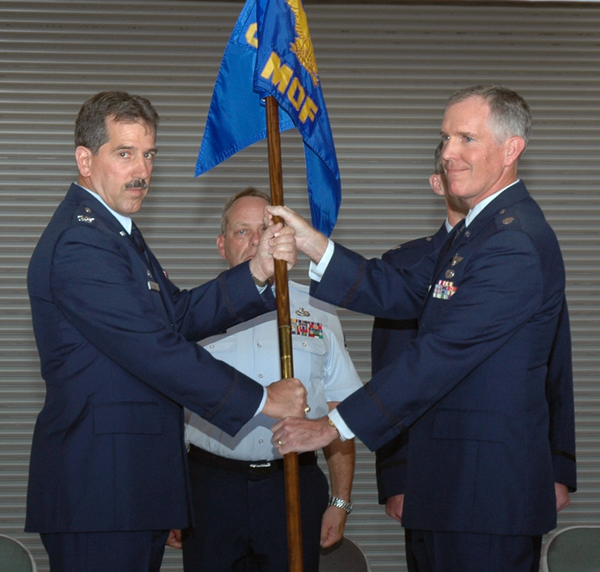 Air Force Reservist Lt. Col. Robert Dunn relinquished command of the 940th Maintenance Operations Flight to Col. Melvin Giddings, Jr., 940th Maintenance Group commander, during a ceremony June 10, 2006 at Beale Air Force Base, Calif.  Colonel Dunn became the new 940 MXG deputy commander. (U.S. Air Force photo/Tech. Sgt. Brynna Bryant)