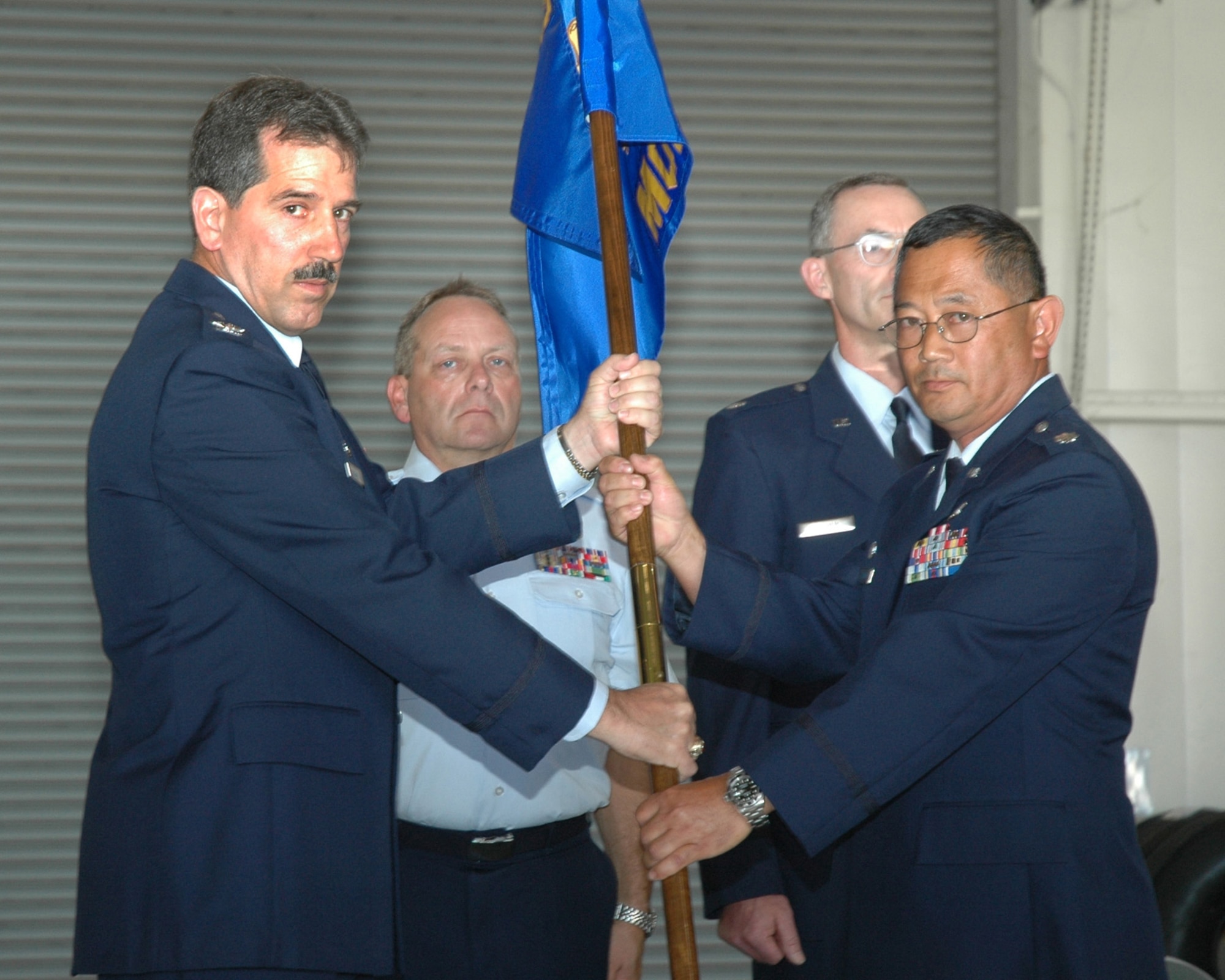 Air Force Reservist Lt. Col. Djoko "Ron" Soejoto accepted command of the 940th Maintenance Operations Flight from Col. Melvin Giddings, Jr., 940th Maintenance Group commander, during a ceremony June 10, 2006 at Beale Air Force Base, Calif.   (U.S. Air Force photo/Tech. Sgt. Brynna Bryant)