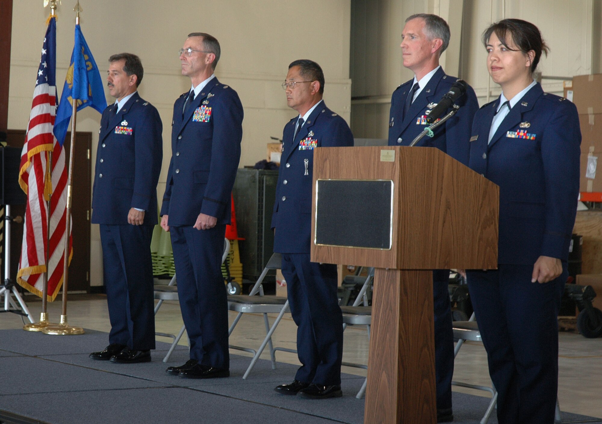 The 940th Aircraft Maintenance Squadron and 940th Maintenance Operations Flight changed leadership during a ceremony June 10, 2006 at Beale Air Force Base, Calif.  Col. Melvin Giddings, Jr., 940th Maintenance Group commander; Lt. Col. Gregory Steuer, 940 AMXS commander; Lt. Col. Djoko "Ron" Soejoto, 940 MOF commander; Lt. Col. Robert Dunn, 940 MXG vice commander, and 1st Lt. Suesan Alexander, 940 MXG, stand at attention for the National Anthem during the ceremony. (U.S. Air Force photo/Tech. Sgt. Brynna Bryant)