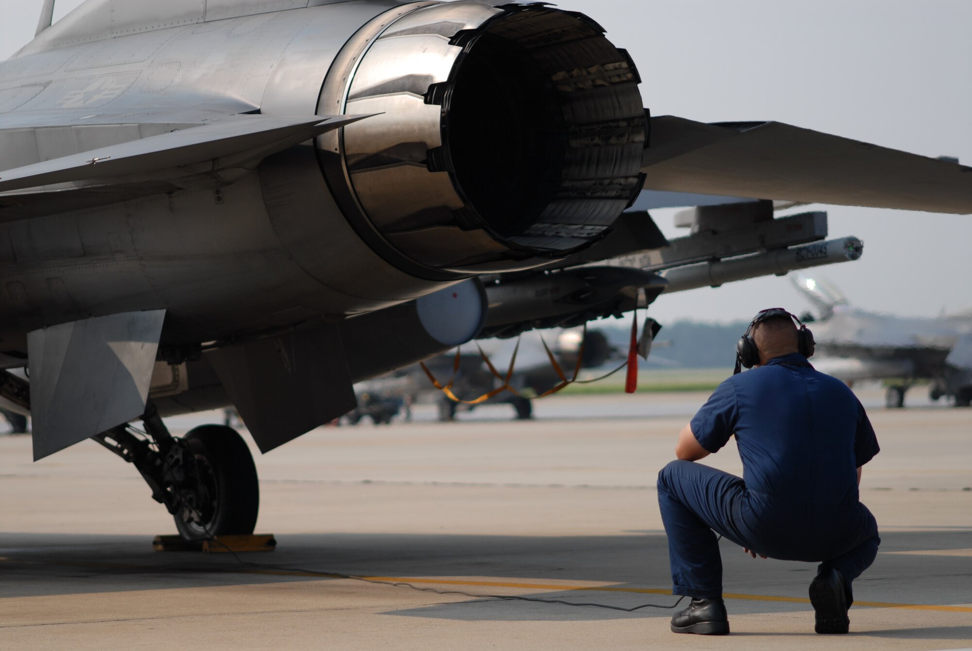 Staff Sgt. Brian Gaylor, 77th Fighter Squadron crew chief, pre-flights an F-16 engine prior to launch in support of Operation Dynamic Weasel June 29, 2006, at Shaw AFB, S.C. Operation Dynamic Weasel is a multi-aircraft exercise imitating combat operations currently taking place in Southeast Asia. (U.S. Air Force Photo/Tech. Sgt. James Arrowood)