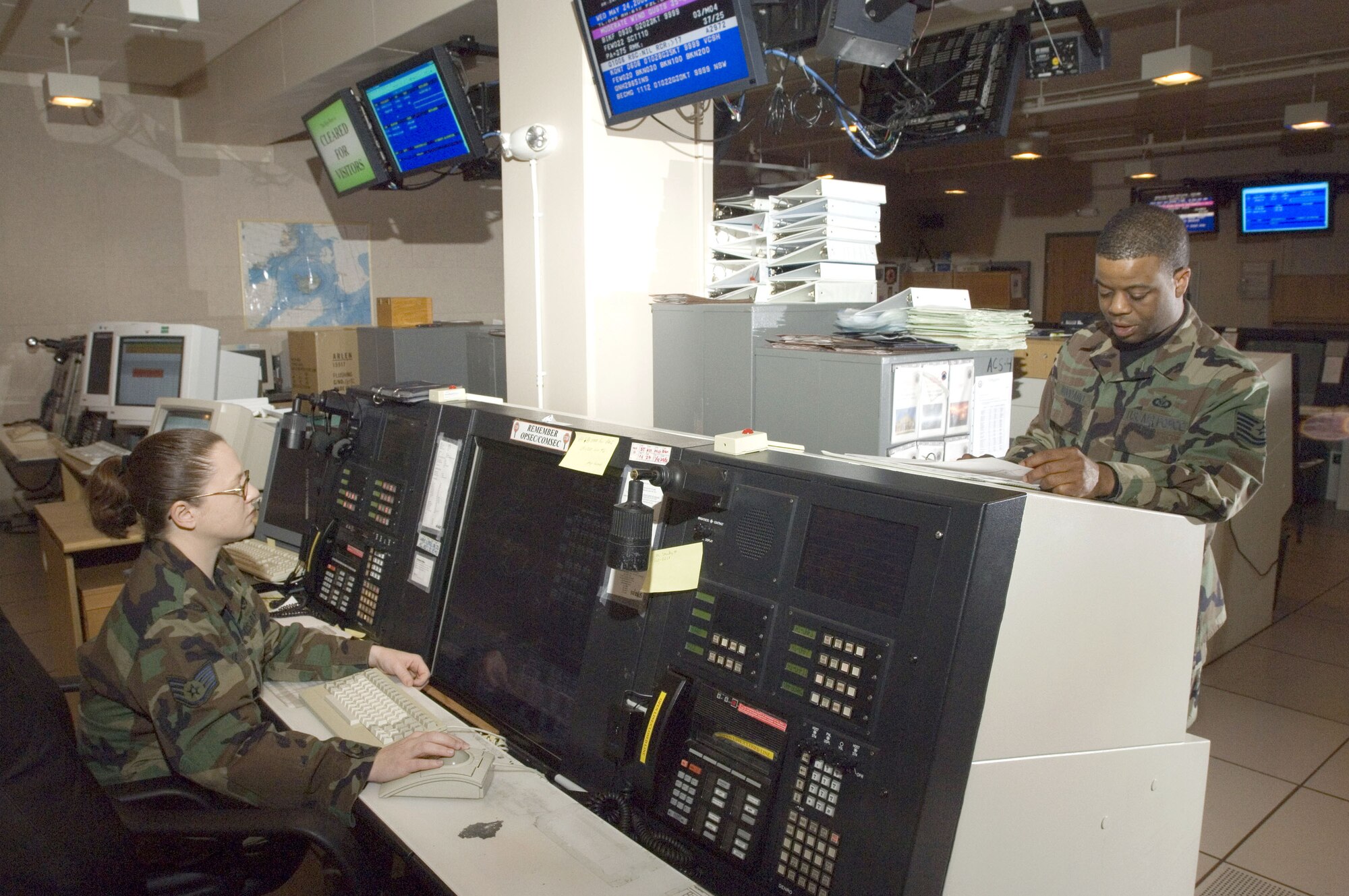 Tech. Sgt. Khalifah Woodard and Staff Sgt. April Jepsen run through an operations check on a radar operator console unit at Naval Air Station Keflavik, Iceland, May 24. Sergeant Woodard is a mission crew commander technician and Sergeant Jepsen is a weapons control technician with Keflavik's 932nd Air Control Squadron. (U.S. Air Force photo/Master Sgt. John E. Lasky)