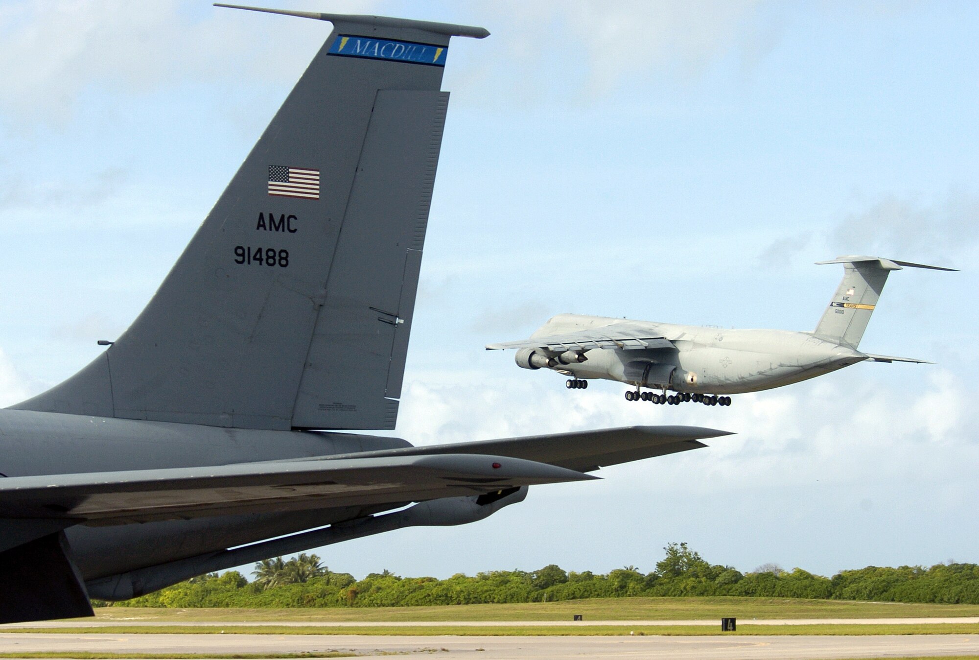 A C-5 Galaxy takes off from a forward operating location today. The C-5 is one of the largest aircraft in the world. The aircraft carries fully equipped combat-ready military units to any point in the world on short notice then provides field support required to help sustain the fighting force. Ground crews can load and off load the C-5 simultaneously at the front and rear cargo openings. (U.S. Air Force photo/Senior Airman Brian Ferguson)