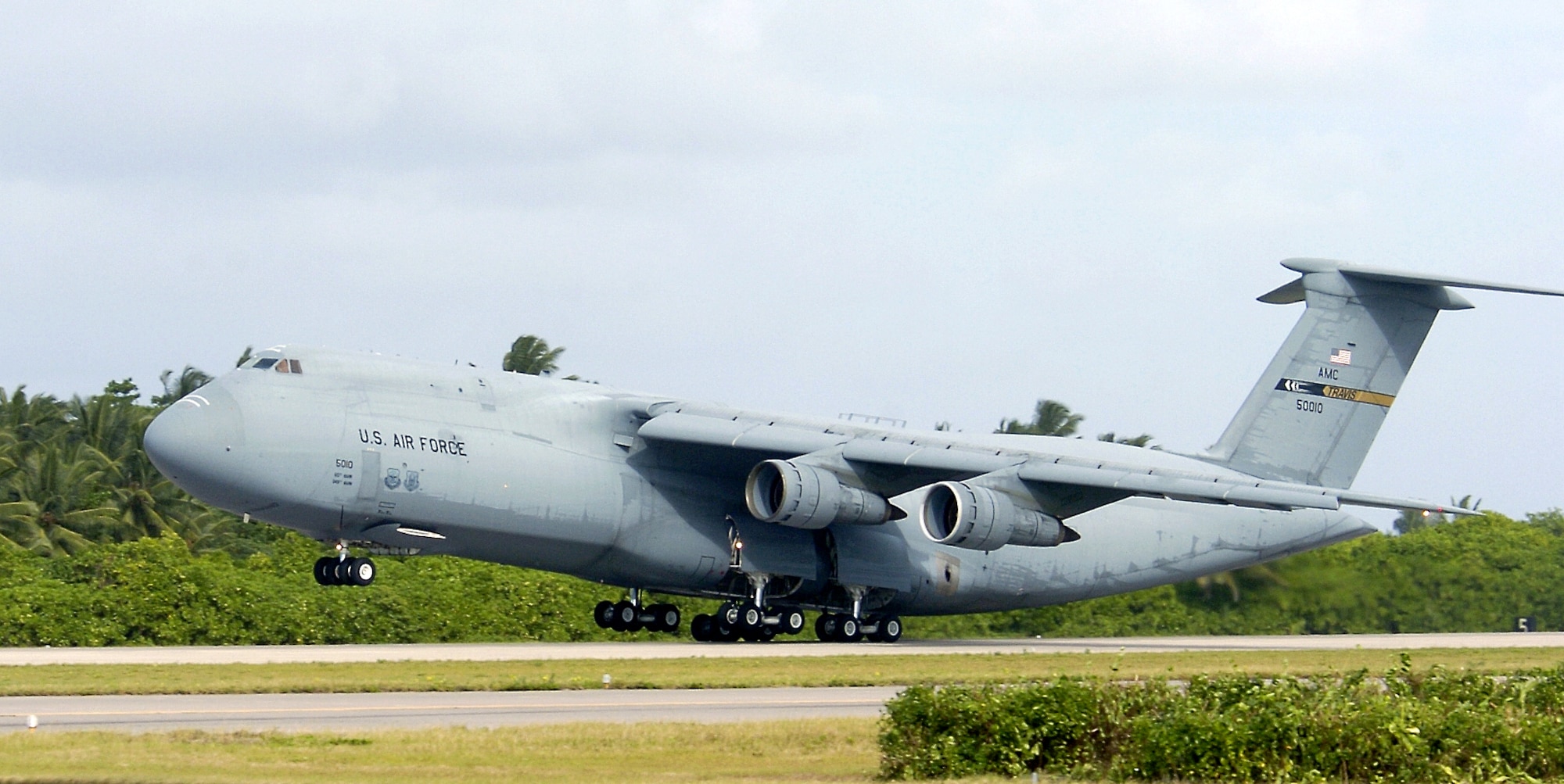 A C-5 Galaxy takes off from a forward operating location today. The C-5 is one of the largest aircraft in the world. The aircraft carries fully equipped combat-ready military units to any point in the world on short notice then provides field support required to help sustain the fighting force. Ground crews can load and off load the C-5 simultaneously at the front and rear cargo openings. (U.S. Air Force photo/Senior Airman Brian Ferguson)