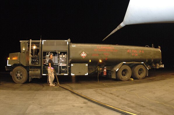 Senior Airman Holly Cather, 379th Expeditionary Logistics Readiness squadron, refuels a Royal Air Force Tornado on the flightline June 20.  Airman Cather is dployed from Shaw to Southwest Asia.  She is assigned to the 20th Logistics Readiness Squadron.  (U.S. Air Force photo/Master Sgt. Douglas Lingefelt)