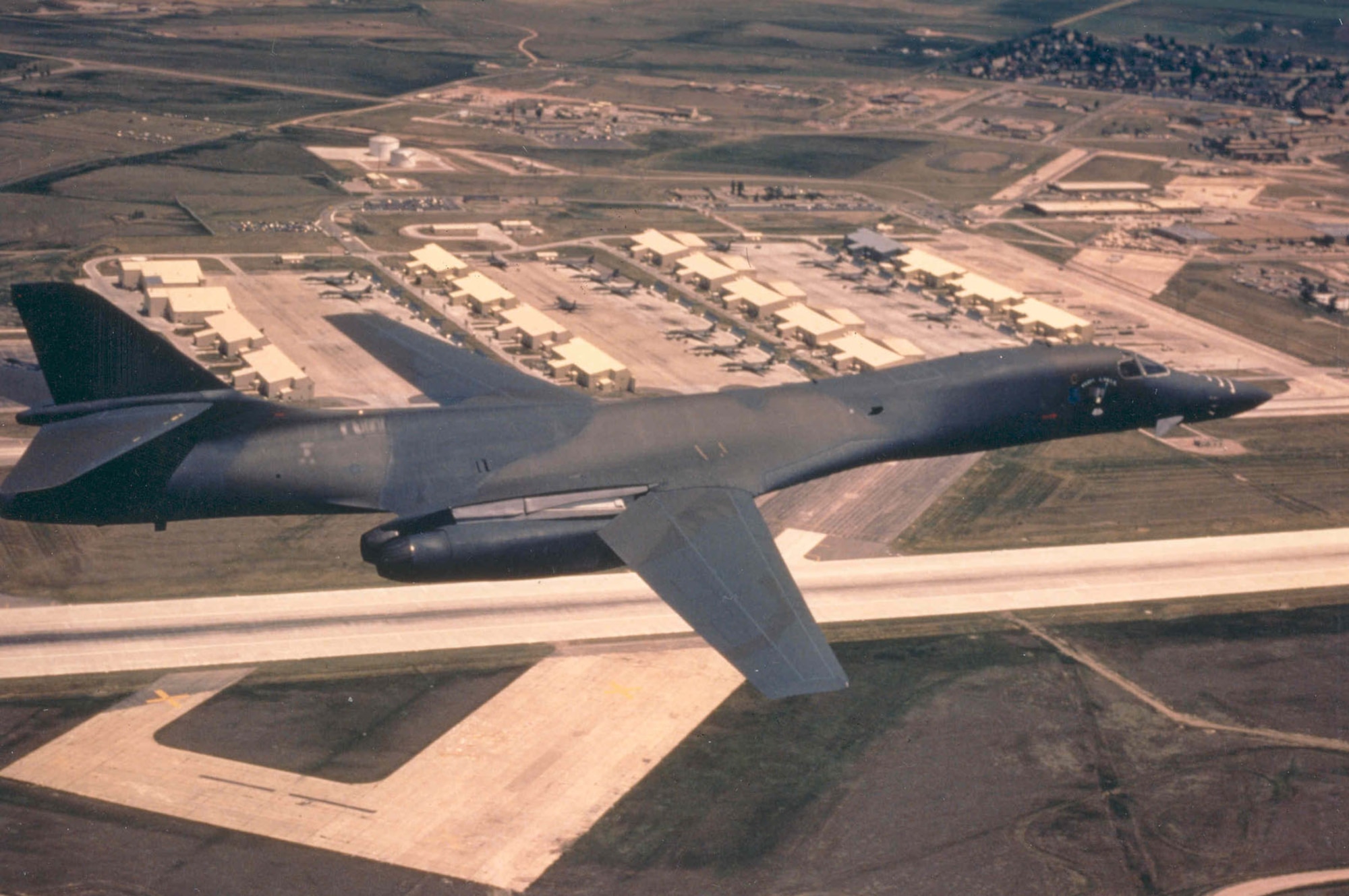 Rockwell International B-1B (S/N 86-097) "Iron Eagle" of the 28th Bomb Wing, Ellsworth Air Force Base, S.D., over the Ellsworth flightline. (U.S. Air Force photo)