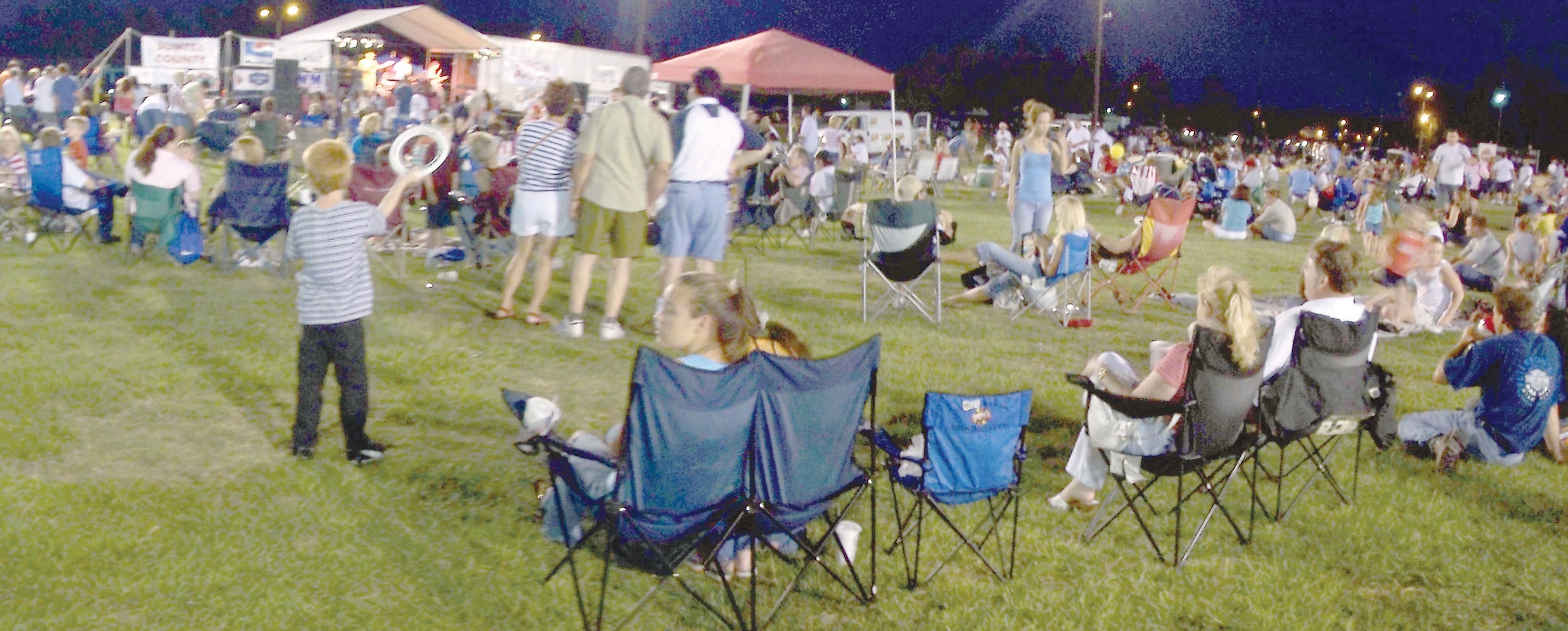 Spectators enjoy the live music and wait in anticipation for the fireworks show to begin at the Jammin' July 4th celebration.  (U.S. Air Force photo/Senior Airman John Gordinier)