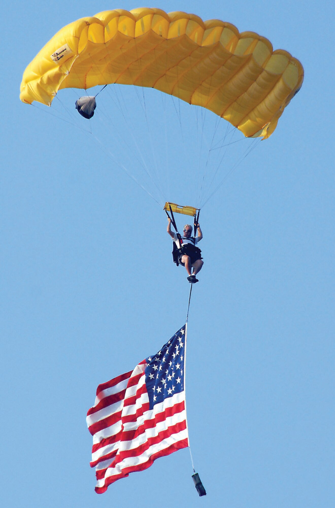 Parachutist Robert Scott dazzles the crowd with his patriotism.  (U.S. Air Force photo/Airman 1st Class Katherine Dodd)