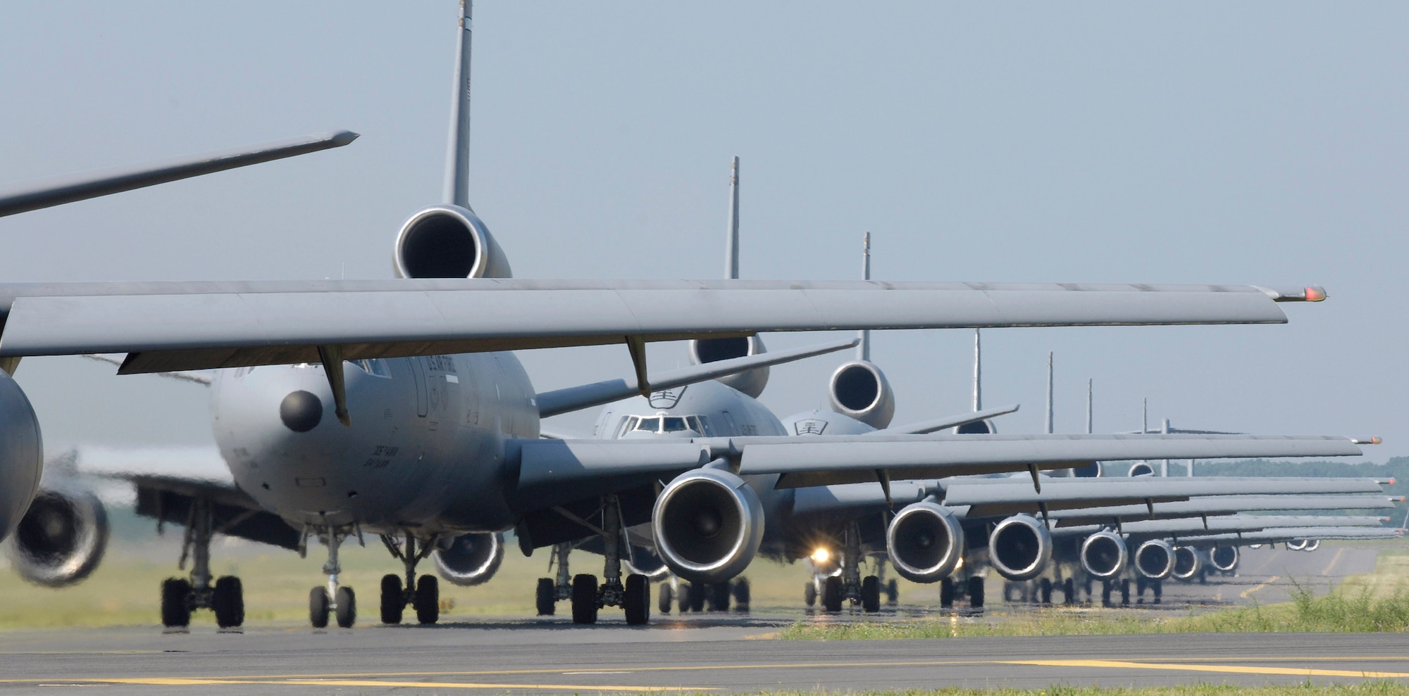 KC-10 Extenders and C-17 Globemaster IIIs from McGuire Air Force Base, N.J., taxi down the flightline during an emergency response exercise elephant walk. This is the first time C-17s and KC-10s have been paired in an exercise. Sixteen aircraft launched from McGuire on Friday, June 30, as part of the exercise. (U.S. Air Force photo/Brian Dyjak) 

