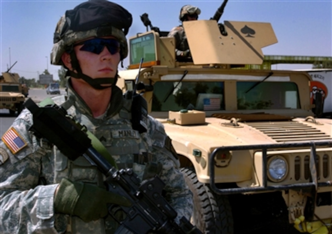 U.S. Army Sgt. Jason Manley conducts a dismounted patrol in Adhamiya near Baghdad, Iraq, on June 27, 2006. Manley is assigned to the 506th Regimental Combat Team, 101st Airborne Division.