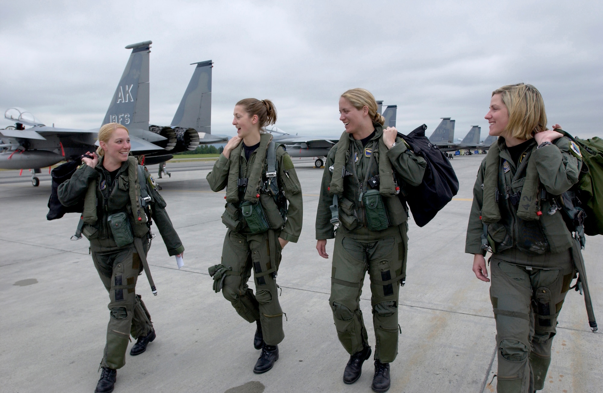 Four F-15 Eagle pilots from the 3rd Wing walk to their respective jets at Elmendorf Air Force Base, Alaska, on Wednesday, July 5, for the fini flight of Maj. Andrea Misener (far left). To her right are Capt. Jammie Jamieson, Maj. Carey Jones and Capt. Samantha Weeks. (U.S. Air Force photo/Tech. Sgt. Keith Brown)