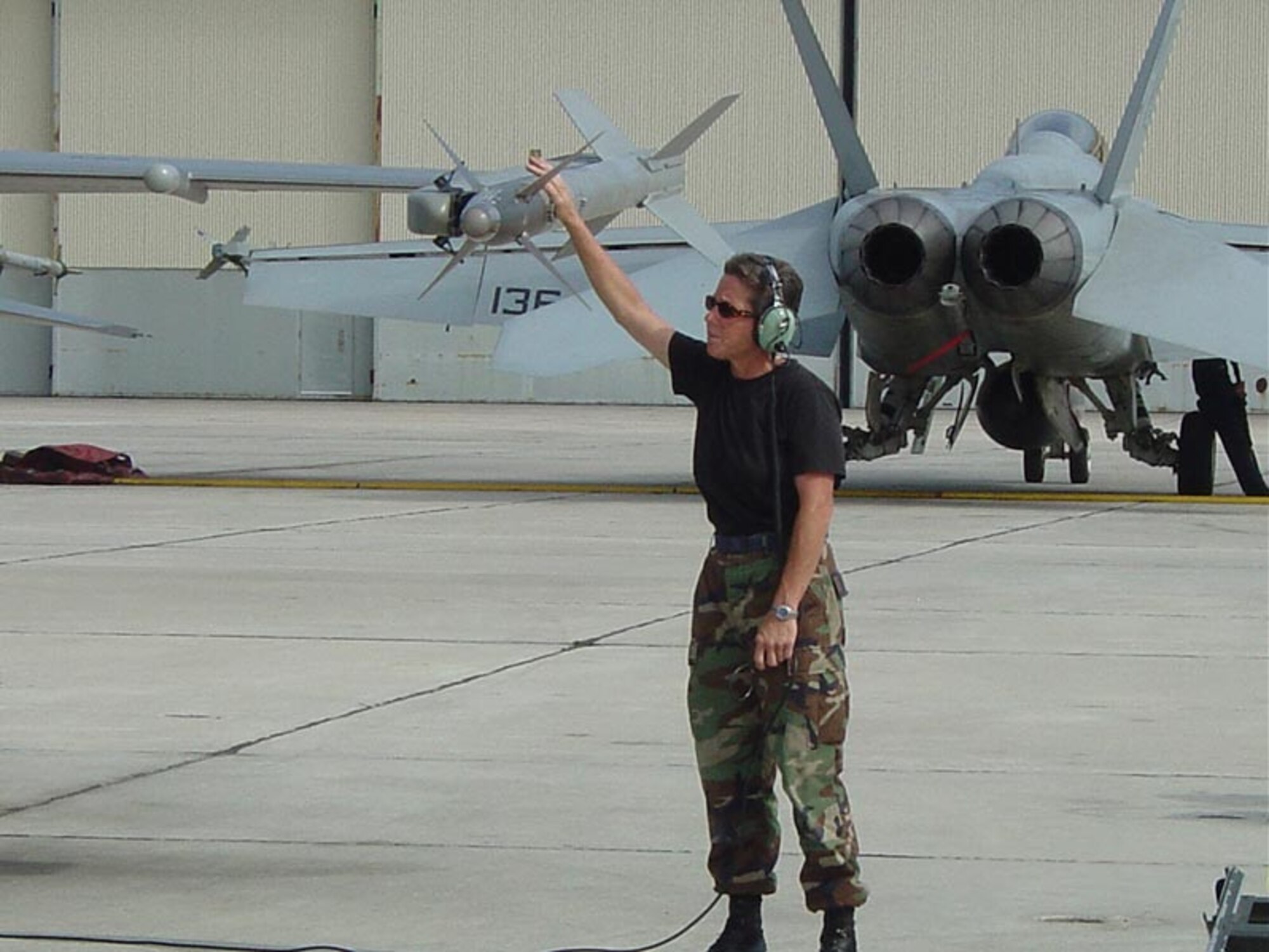 Tech. Sgt. Susan Knickerbocker, 944th AMXS maintenance technician, gives a final armament visual check prior to take off. (Courtesy photo)             