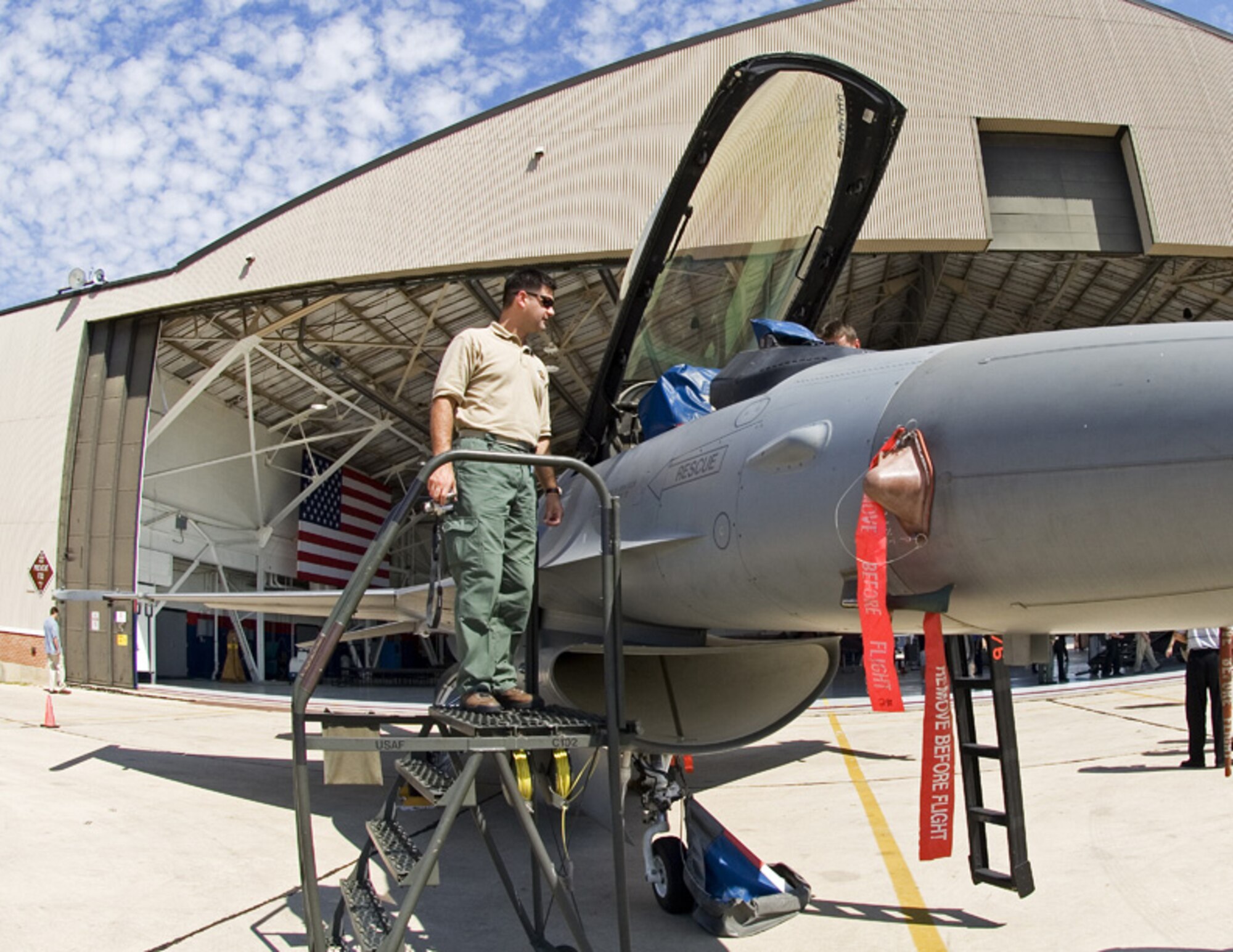 Sergeant Scott Masino, Phoenix Police Department, learns about the F-16 during a civic leader tour May 18 to Lackland Air Force Base, Texas. The Texas Air National Guard's 149th Fighter Wing provided the static F-16 for the tour. (Photo by Hal Becker)