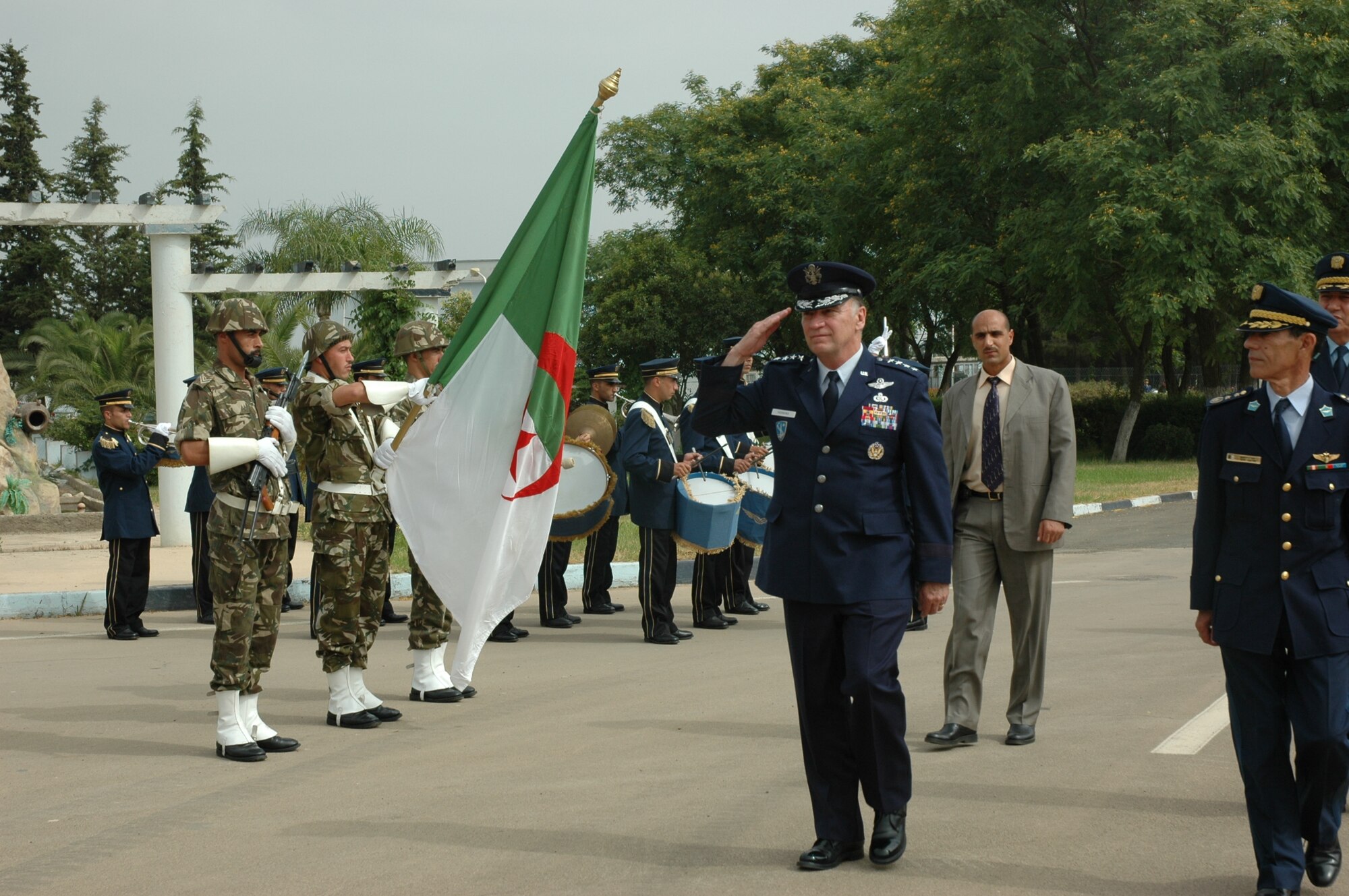 ALGIERS, Algeria -- General Tom Hobbins, U.S. Air Forces in Europe commander, salutes during an honors ceremony held for him at Boufarik Air Base in Algeria June 24.  General Hobbins toured the base and met with military and defense leadership during his first trip to North Africa June 22-28.  