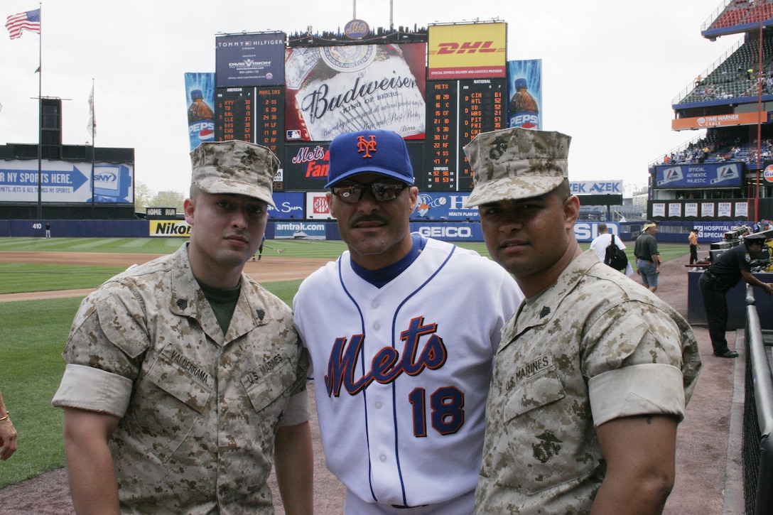 Sgt. Juan Valderama and Sgt. Boile Sanchez, recruiters assigned to Recruiting Station New York, pose for a quick photo with New York Mets 2nd baseman Jose Valentin before game at Shea Stadium during Military Appreciation Day, July 9.