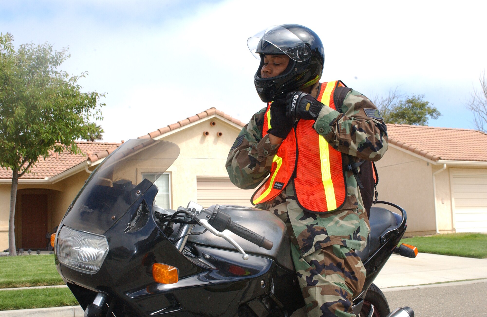 VANDENBERG AFB, Calif. – Staff Sgt. Allen Puckett fastens the chin strap of his Department of Transportation-approved helmet. Proper wear of safety equipment is an essential element of reducing risk while riding motorcycles. (Photo by Staff Sgt. Orly Tyrell)  


 
