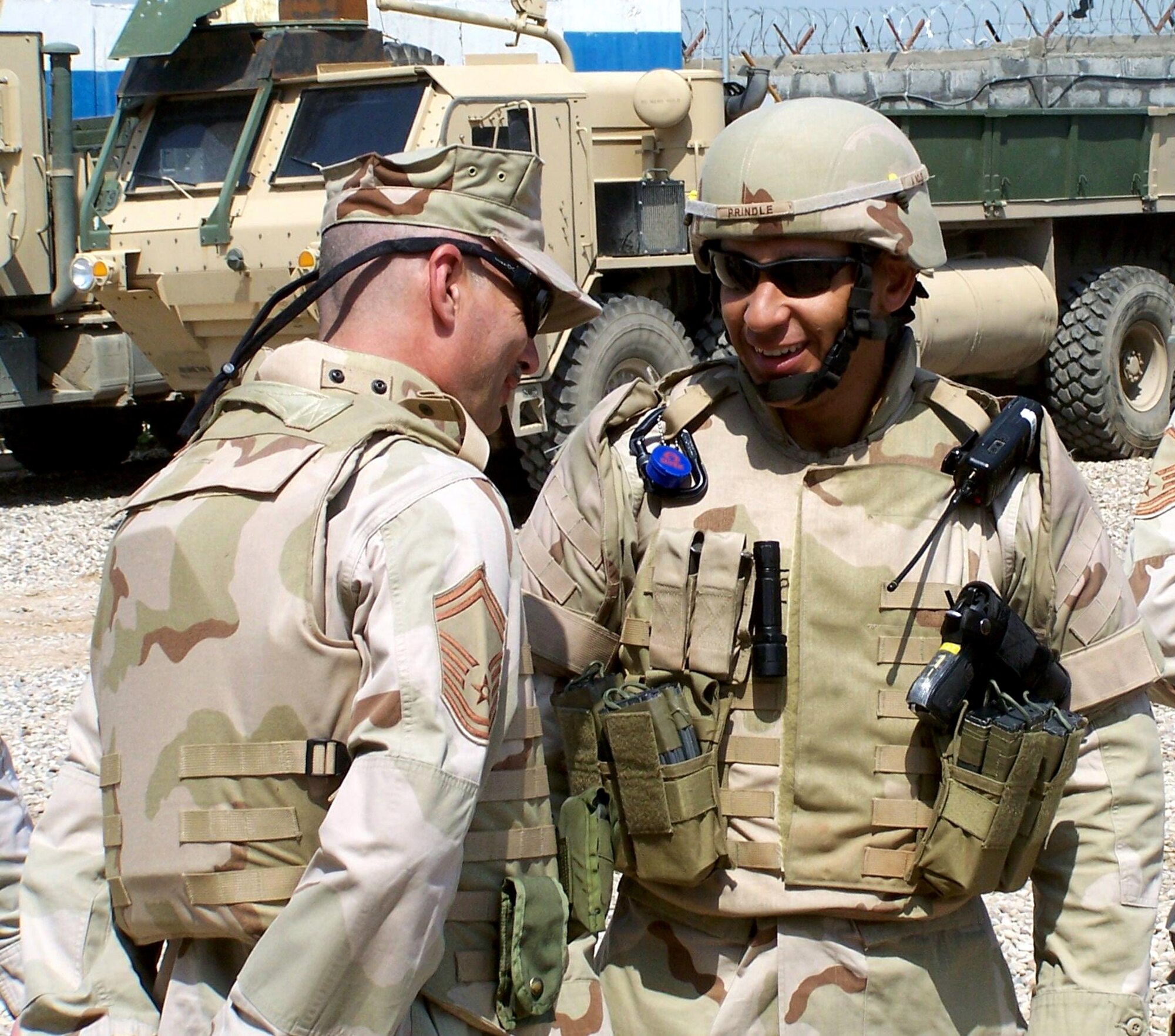 Maj. Jeffery Prindle (right) and Senior Master Sgt. Edward Bock discuss a convoy mission prior to heading out. Major Prindle is the commander of the 732nd Expeditionary Security Forces Squadron, Detachment 6 in Mosul, Iraq deployed from the 315th Security Forces Squadron at Charleston Air Force Base, S.C. Sergeant Bock is an Air National Guard member from the 185th Airlift Wing, Iowa. (U.S. Air Force photo/Tech. Sgt. Steven Doner)