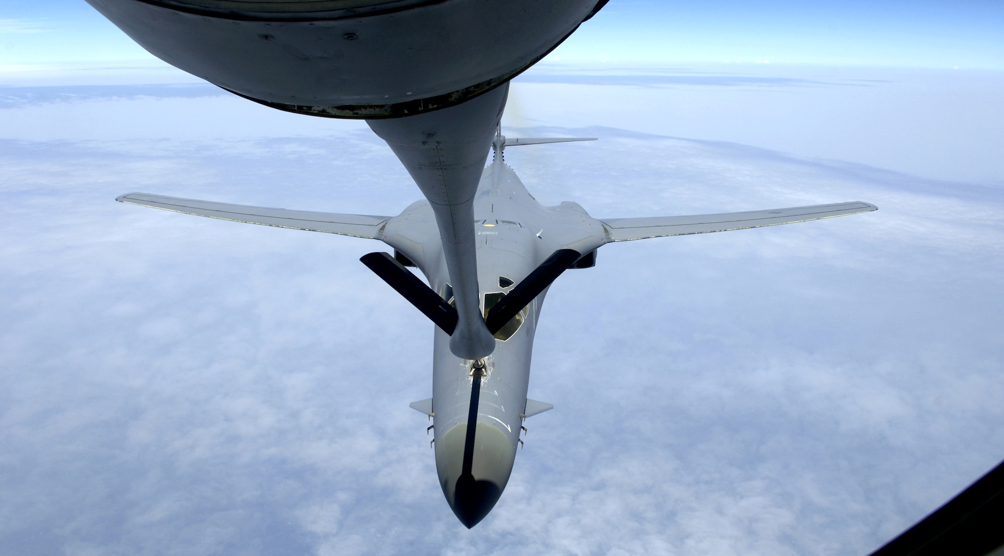 A B-1B Lancer connects with a KC-135 Stratotanker refueling boom over the Indian Ocean on Friday, July 7. The B-1 was flying a close-air support mission in support of Operation Enduring Freedom. The B-1 and KC-135 aircraft are stationed at a forward operating base in Southwest Asia. (U.S. Air Force photo/Senior Airman Brian Ferguson)
