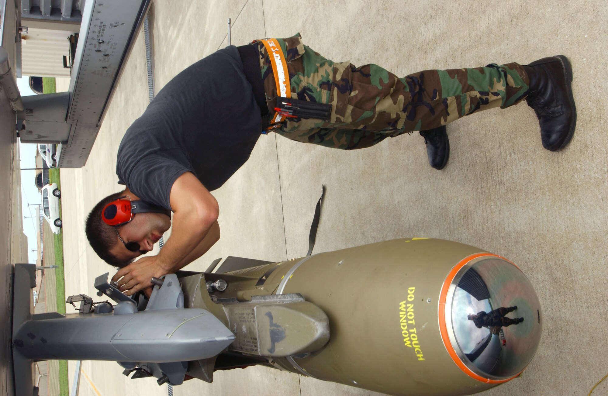 Staff Sgt. Matthew McKinley secures a Maverick air-to-ground missle to an F-16 Fighting Falcon at Kunsan Air Base, South Korea, on July 5. The aircraft is from the Montana Air National Guard's 120th Fighter Wing at Great Falls.   (U.S. Air Force photo/Tech. Sgt. Erik Gudmundson)
