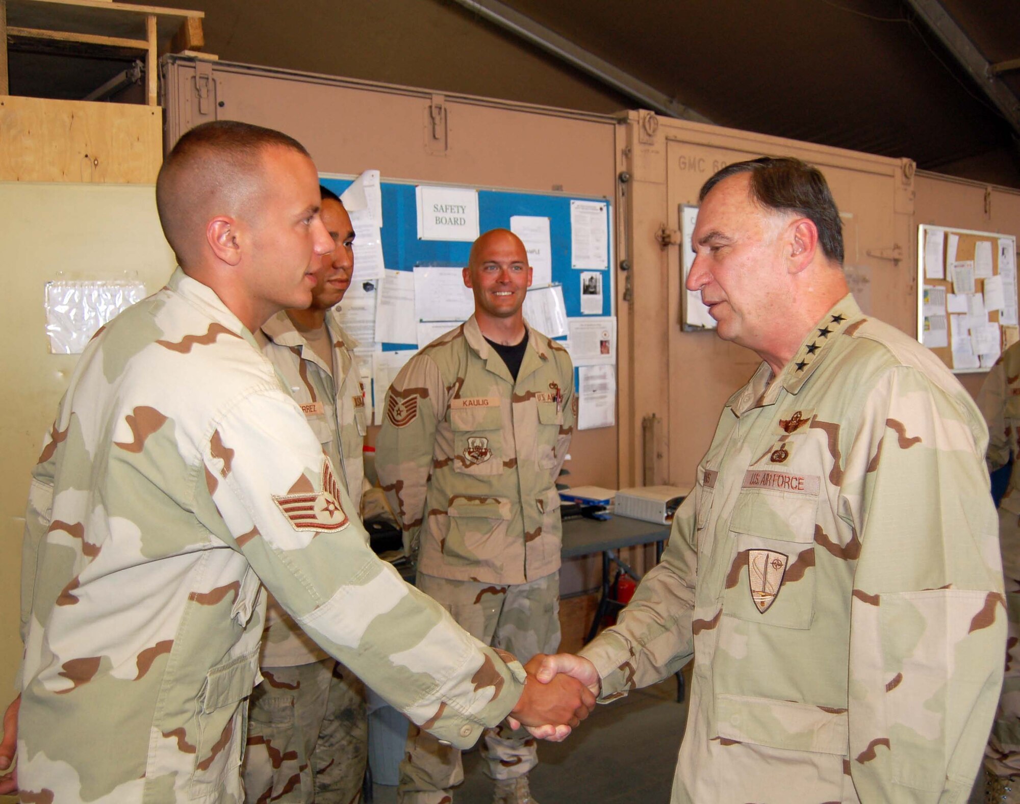MANAS AIR BASE, Kyrgyzstan-- General Tom Hobbins, USAFE commander greets Staff Sgt. Anthony Allen, 376th Expeditionary Aircraft Maintenance Squadron, during his visit July 5.