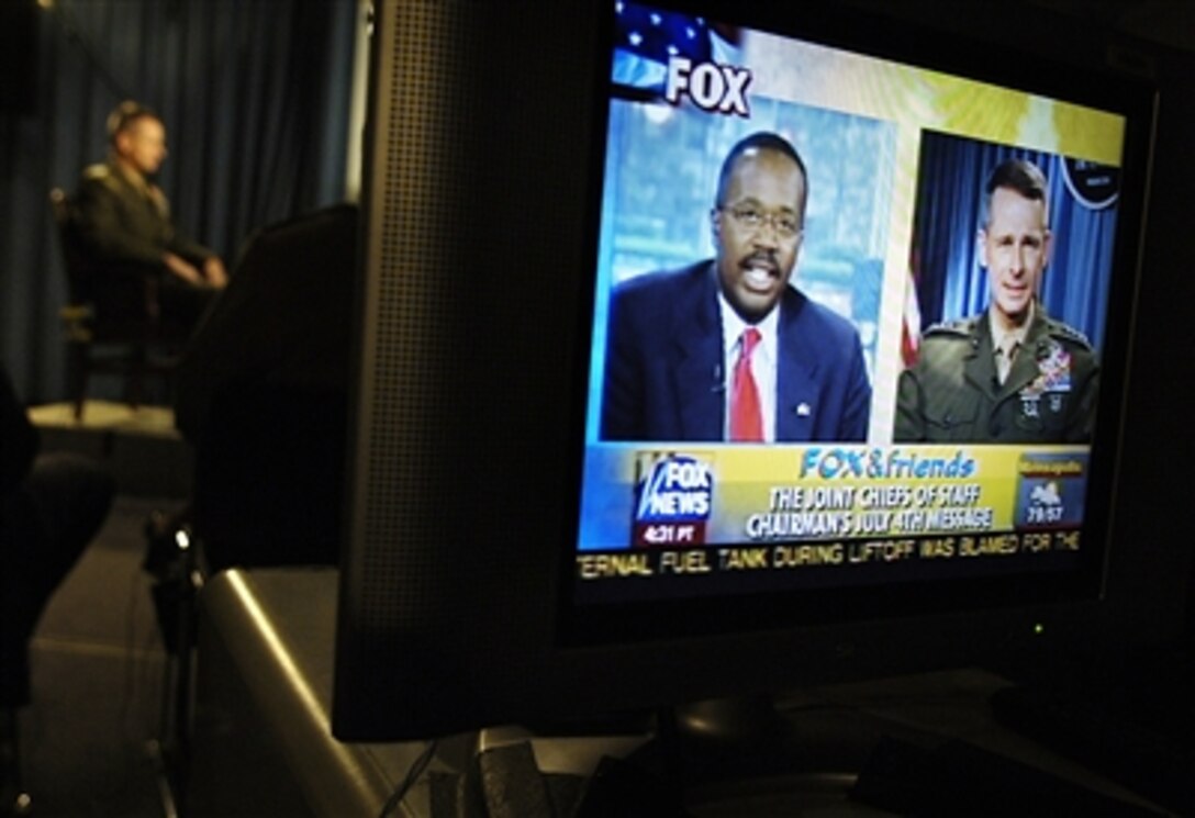 Chairman of the Joint Chiefs of Staff U.S. Marine Gen. Peter Pace gives a live television interview from the Pentagon, July 4, 2006. He thanked servicemembers and their families for their commitment to the nation. 