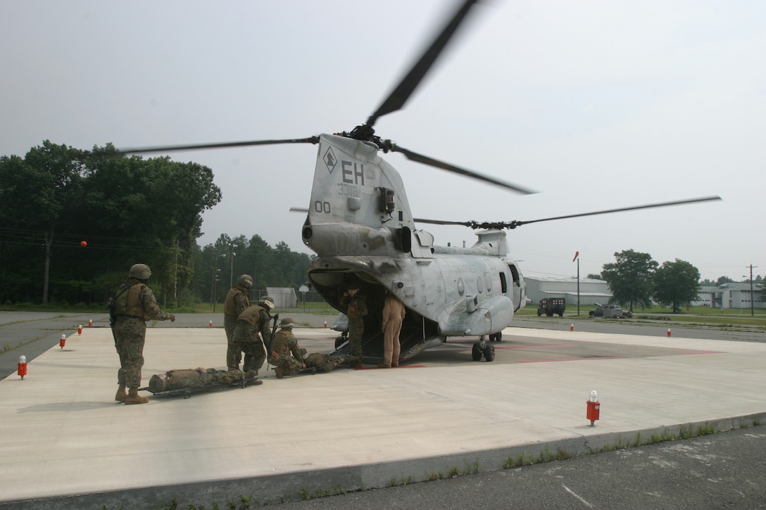 Marines and Sailors of the 26th Marine Expeditionary Unit take part in a mass casualty exercise July 11, 2006., at Fort A.P. Hill, Va.  The exercise emphasized litter-bearer training, in which Marines and Sailors had to properly load, secure and remove litters holding casualtieso.  (Official USMC photo by Lance Cpl. Aaron J. Rock) (Released)