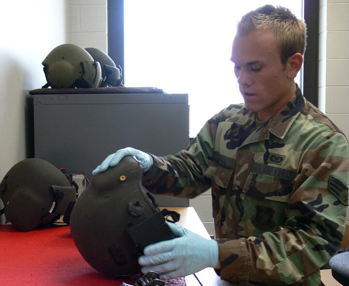 MOODY AIR FORCE BASE, Ga. -- Senior Airman J. Michael Lundell, 41st Rescue Squadron aircrew life support journeyman, looks over a helmet before mounting night-vision goggles to it. Airman Lundell was selected as the Air Force’s 2005 Outstanding Life Support Aircrew Airman. (Photo by Senior Airman Ticia Hopkins)