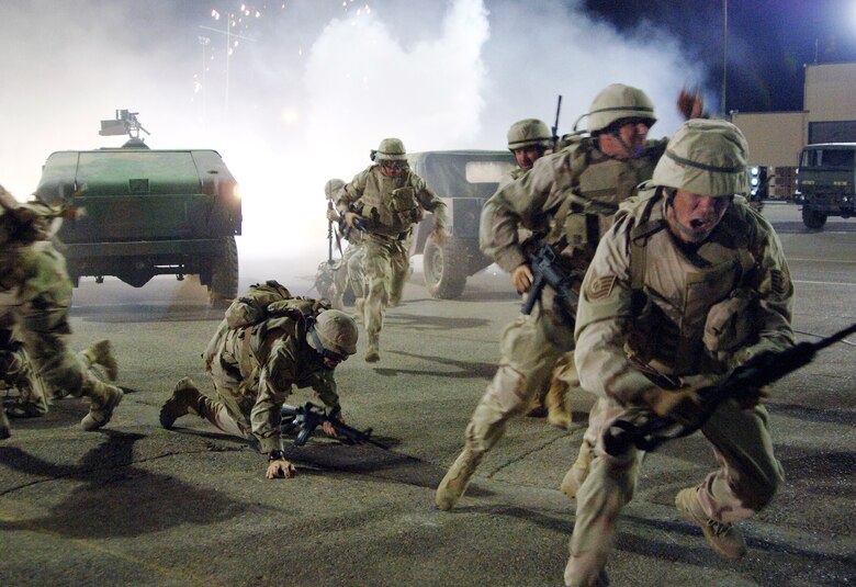 Airmen filling the roles of extras on the set of the movie "Transformers" run for cover during filming at Holloman Air Force Base, N.M., on May 31. The movie is scheduled for release in July 2007. (U.S. Air Force photo/Tech. Sgt. Larry A. Simmons)

